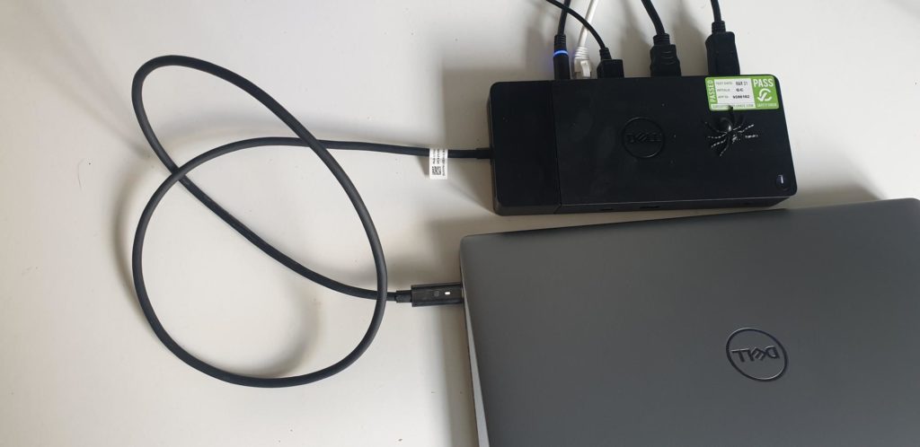 Photo of laptop attached to docking station